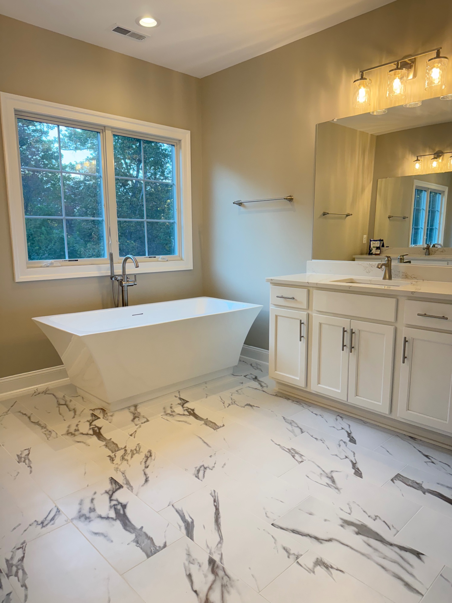 Illustrative photo of a clean bathroom vanity and fixtures